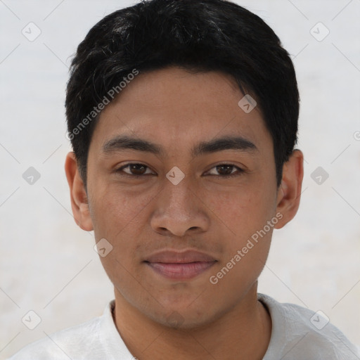 Joyful asian young-adult male with short  black hair and brown eyes