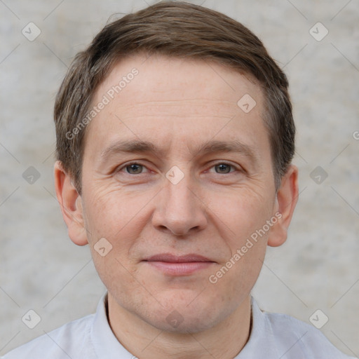 Joyful white adult male with short  brown hair and grey eyes