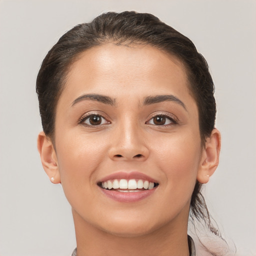 Joyful white young-adult female with short  brown hair and brown eyes