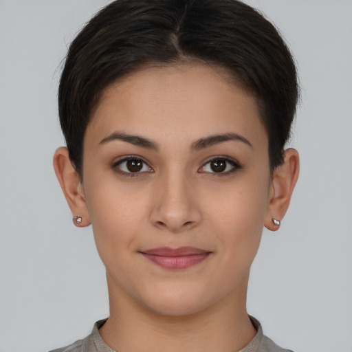 Joyful white young-adult female with short  brown hair and brown eyes