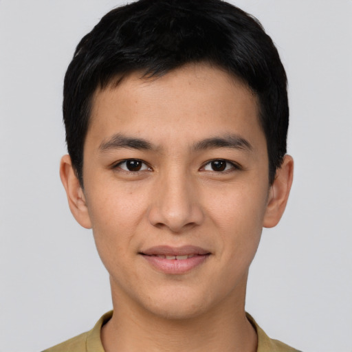 Joyful asian young-adult male with short  brown hair and brown eyes