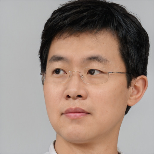 Neutral asian young-adult male with short  brown hair and brown eyes