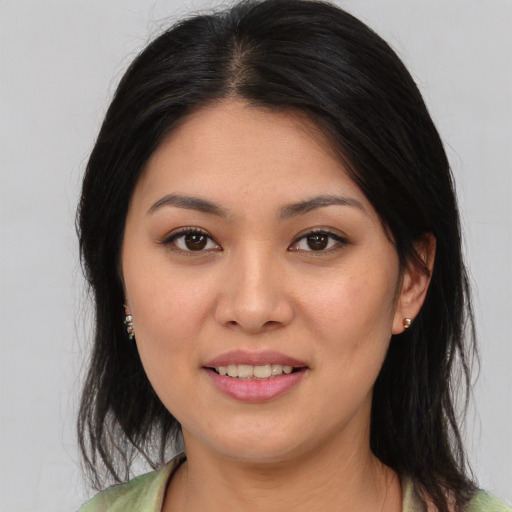 Joyful asian young-adult female with medium  brown hair and brown eyes