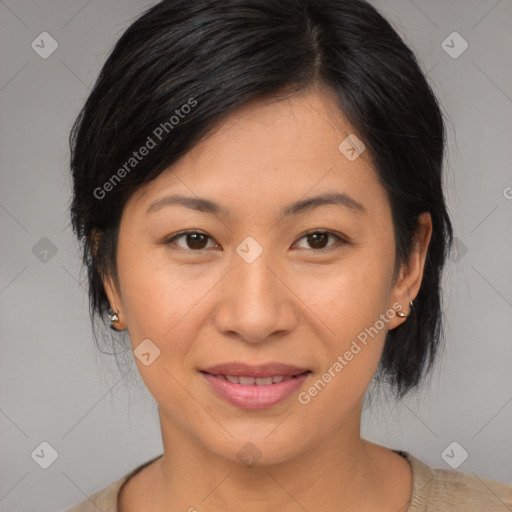 Joyful asian adult female with medium  brown hair and brown eyes