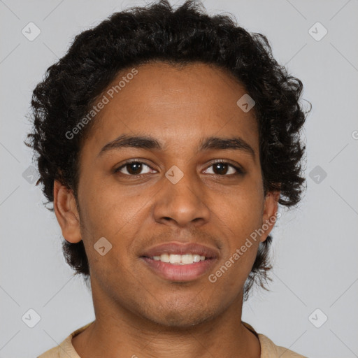 Joyful black young-adult male with short  brown hair and brown eyes