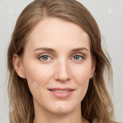 Joyful white young-adult female with long  brown hair and blue eyes