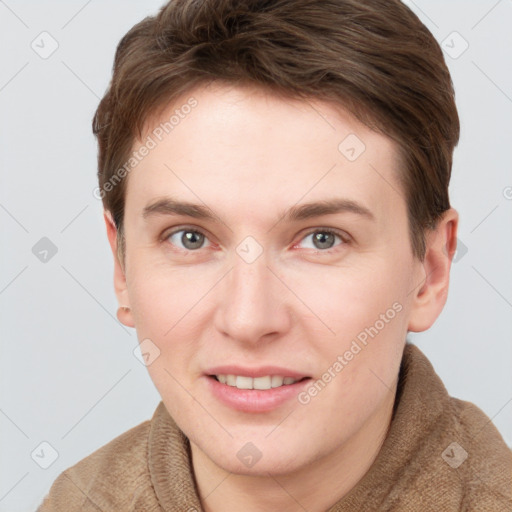 Joyful white young-adult female with short  brown hair and grey eyes