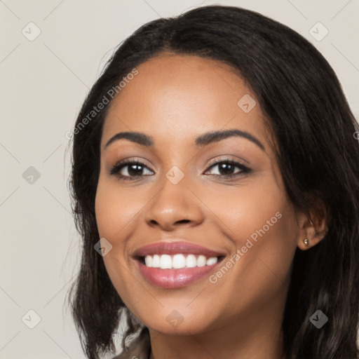 Joyful latino young-adult female with long  black hair and brown eyes