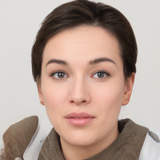 Neutral white young-adult female with short  brown hair and brown eyes