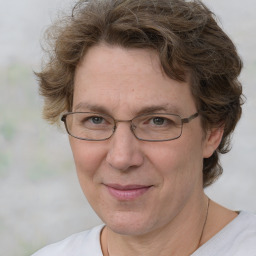 Joyful white middle-aged female with short  brown hair and brown eyes