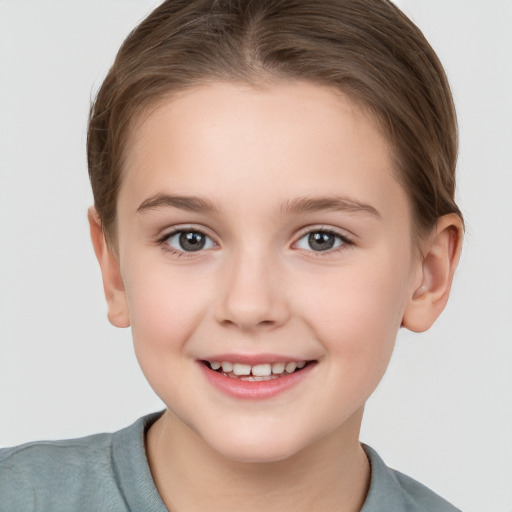 Joyful white child female with short  brown hair and brown eyes