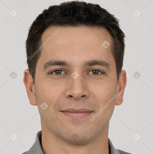 Joyful white young-adult male with short  brown hair and brown eyes