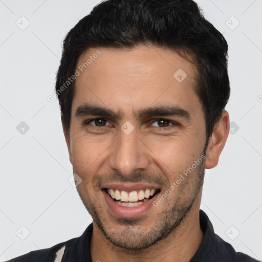 Joyful white young-adult male with short  black hair and brown eyes