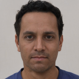 Neutral white young-adult male with short  black hair and brown eyes
