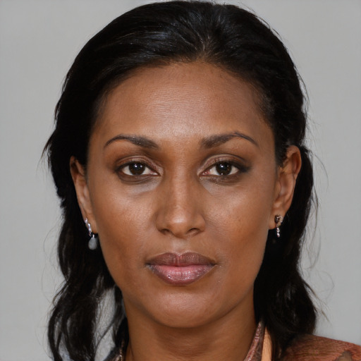 Neutral black young-adult female with medium  brown hair and brown eyes