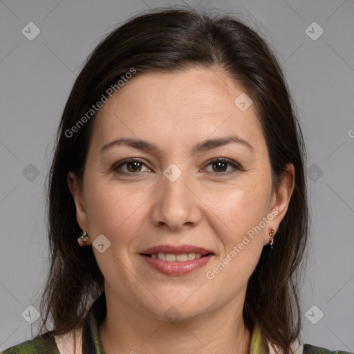 Joyful white adult female with medium  brown hair and brown eyes