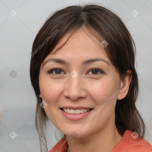 Joyful white young-adult female with medium  brown hair and brown eyes