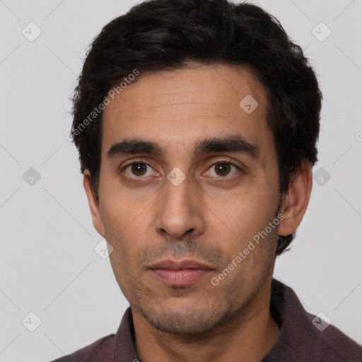 Neutral white young-adult male with short  black hair and brown eyes