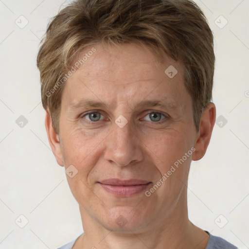 Joyful white adult female with short  brown hair and grey eyes