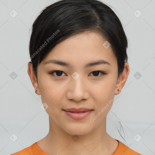 Joyful asian young-adult female with short  brown hair and brown eyes