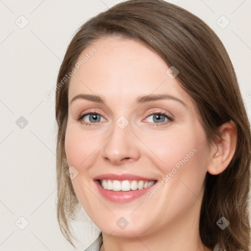 Joyful white young-adult female with medium  brown hair and blue eyes