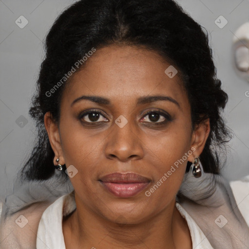 Joyful black adult female with medium  brown hair and brown eyes