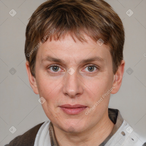 Joyful white adult male with short  brown hair and grey eyes