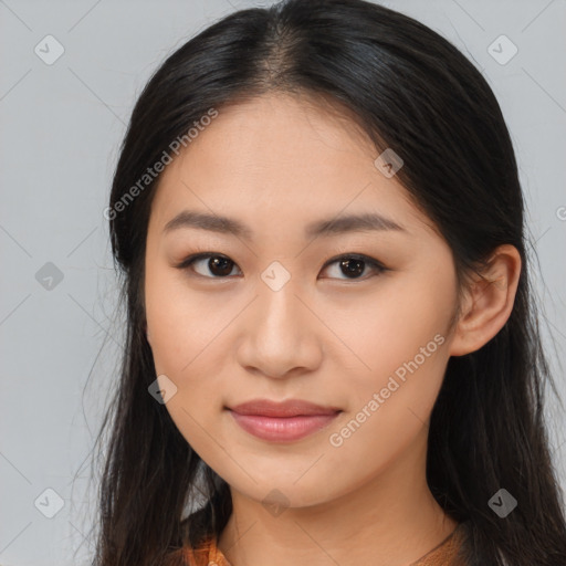 Joyful asian young-adult female with long  brown hair and brown eyes