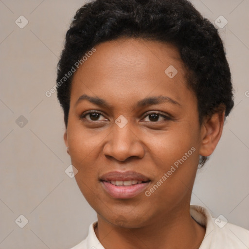 Joyful black young-adult female with short  black hair and brown eyes