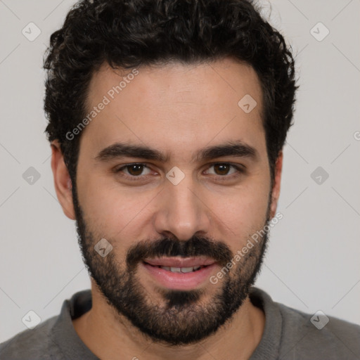 Joyful white young-adult male with short  black hair and brown eyes