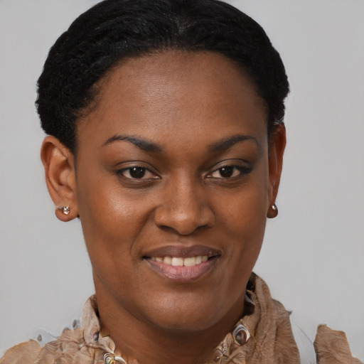 Joyful black young-adult female with short  brown hair and brown eyes