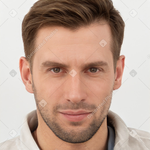 Joyful white young-adult male with short  brown hair and grey eyes