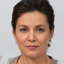 Joyful white adult female with short  brown hair and brown eyes