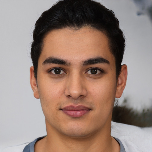 Neutral latino young-adult male with short  brown hair and brown eyes