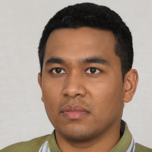 Neutral latino young-adult male with short  black hair and brown eyes