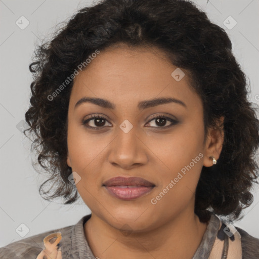 Joyful black young-adult female with long  brown hair and brown eyes