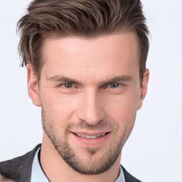 Joyful white young-adult male with short  brown hair and grey eyes