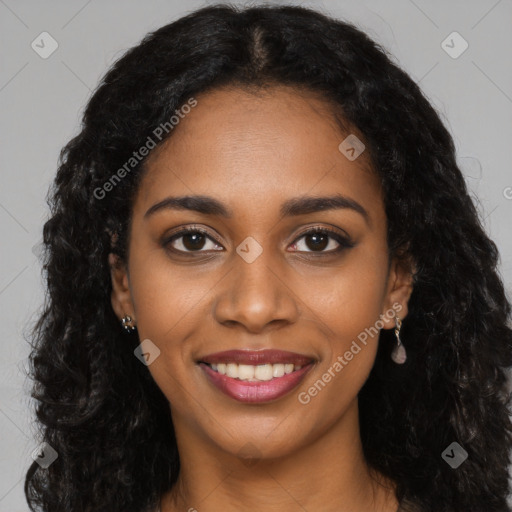 Joyful black young-adult female with long  black hair and brown eyes