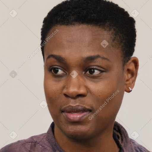 Joyful black young-adult female with short  black hair and brown eyes