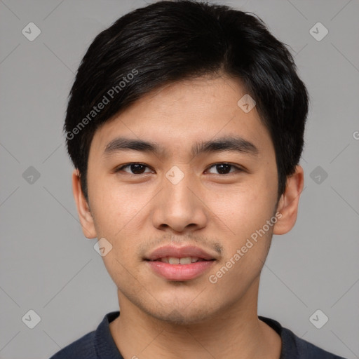 Joyful asian young-adult male with short  black hair and brown eyes