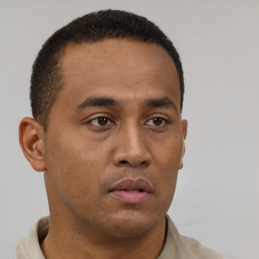 Neutral black young-adult male with short  brown hair and brown eyes