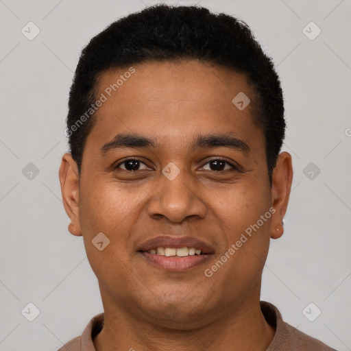 Joyful latino young-adult male with short  brown hair and brown eyes