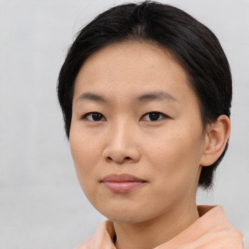 Neutral asian young-adult female with short  brown hair and brown eyes
