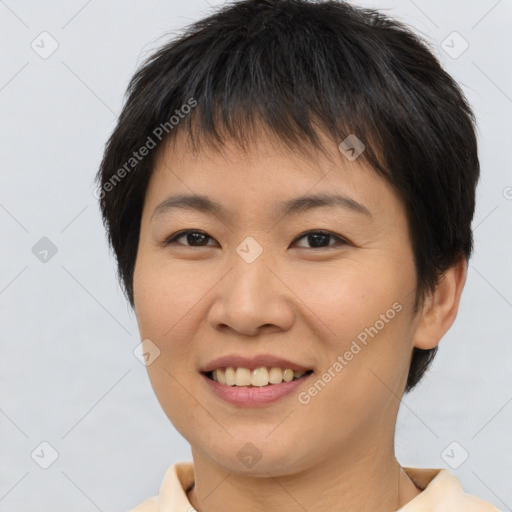 Joyful asian young-adult female with short  brown hair and brown eyes