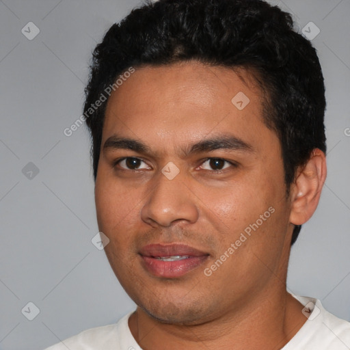 Joyful white young-adult male with short  black hair and brown eyes