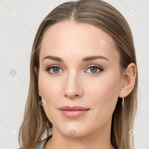 Joyful white young-adult female with long  brown hair and blue eyes