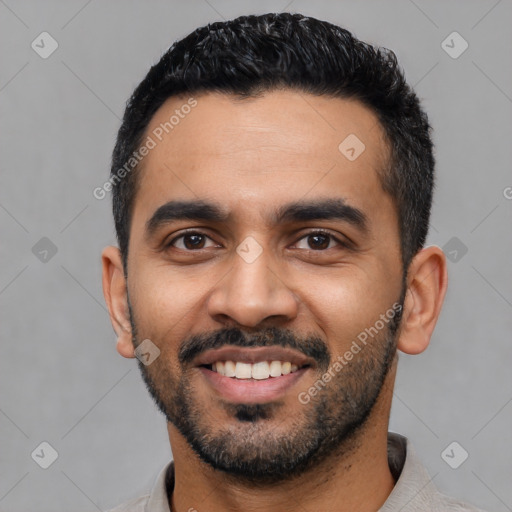 Joyful latino young-adult male with short  black hair and brown eyes