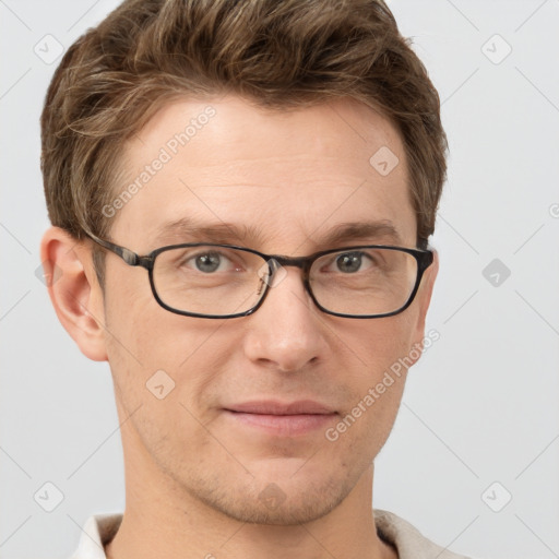 Joyful white adult male with short  brown hair and grey eyes