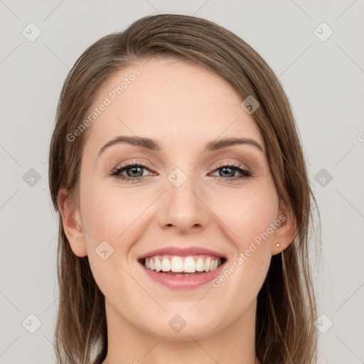 Joyful white young-adult female with long  brown hair and grey eyes