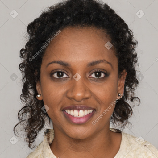 Joyful black young-adult female with long  brown hair and brown eyes